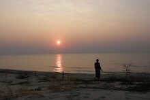 Strand mit Sonnenuntergang in der Nkhotakota Pottery Lodge