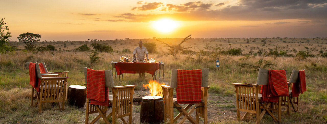 Sonnenuntergang am Lagerfeuer des Nyikani Migration Camp Kogatande