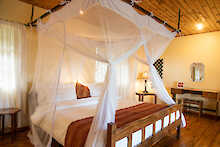 Utengule Coffee Lodge Schlafzimmer mit Doppelbett