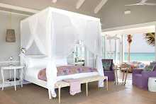 Doppelbett mit Mosquitonetz auf Thanda Island